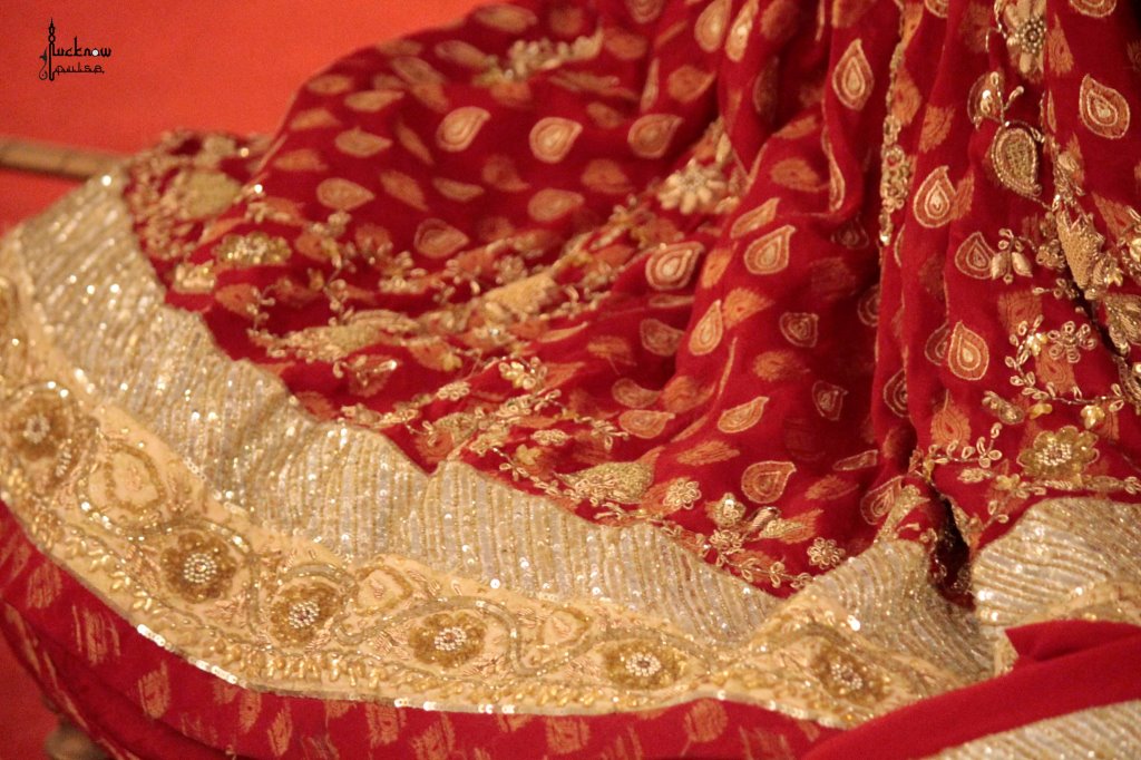 Picture of a maroon and golden lehnga