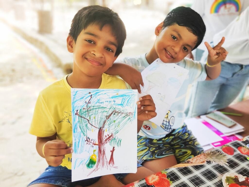 Kids painting at the Mango Festival, Vintage Village